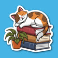 Cat Sleeping On Books With A Houseplant